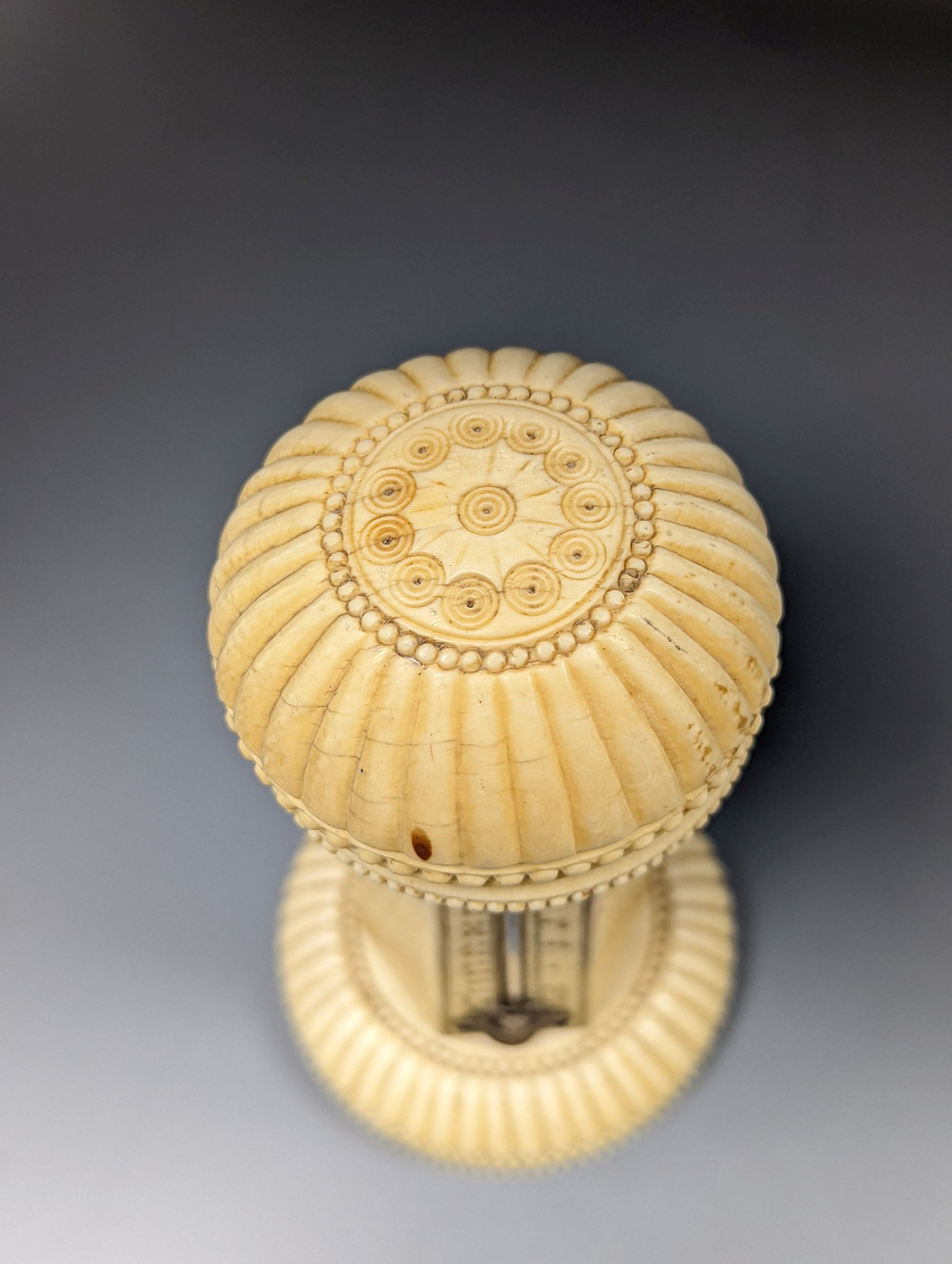 A 19th century ivory table thermometer, 13cm.
